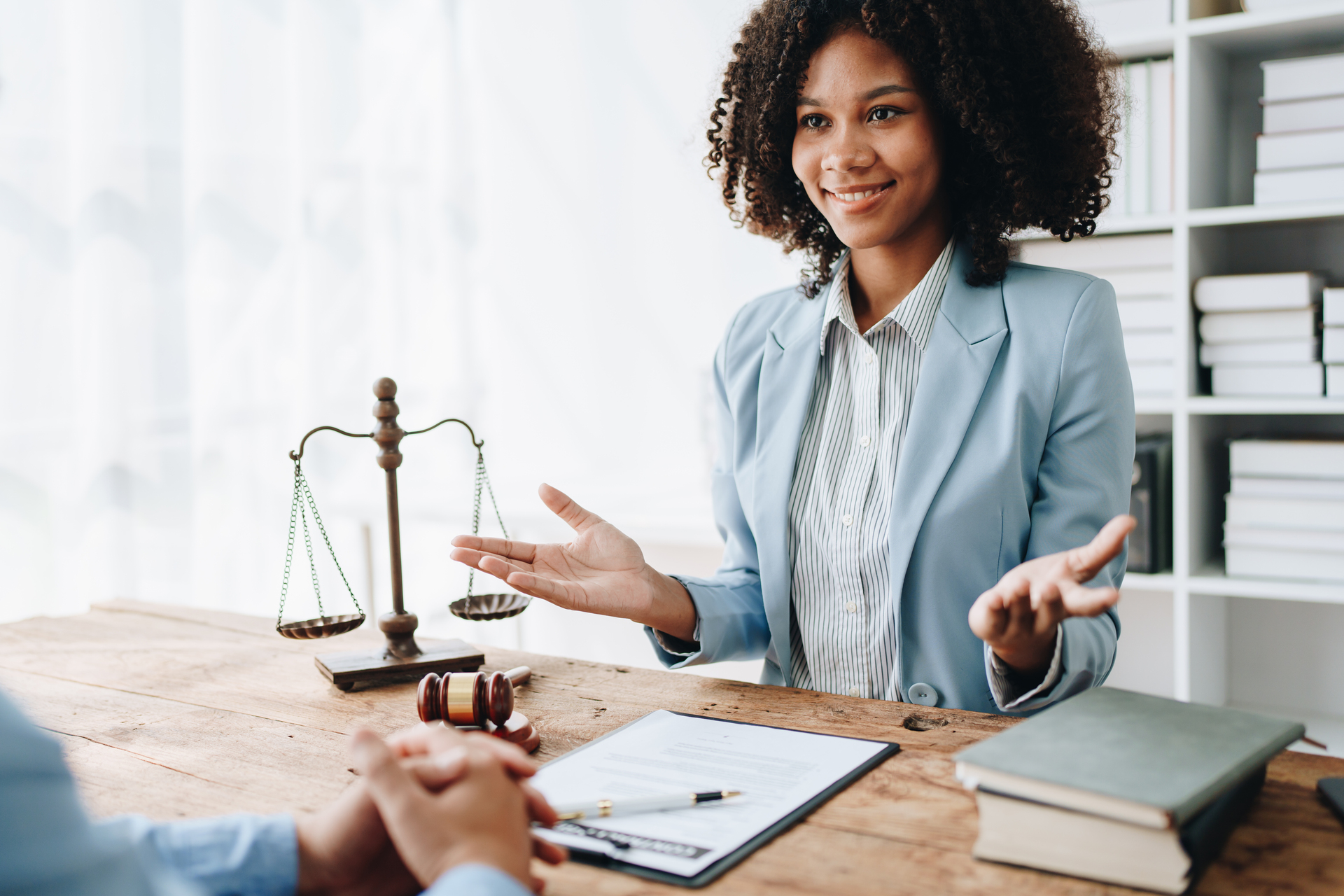 Female lawyer talking to her colleague or client