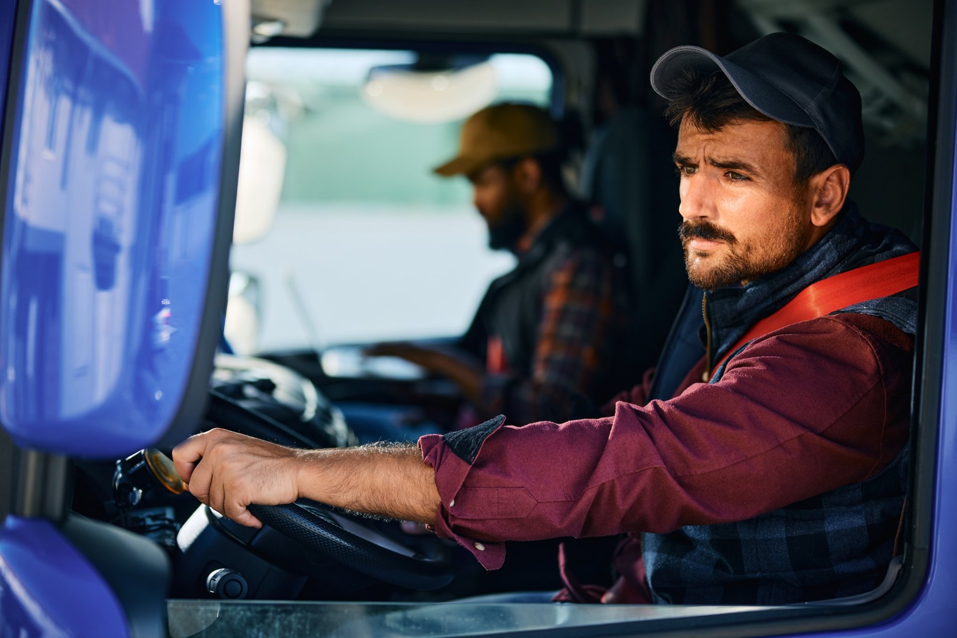 Focused truck driver looking ahead while operating a commercial vehicle
